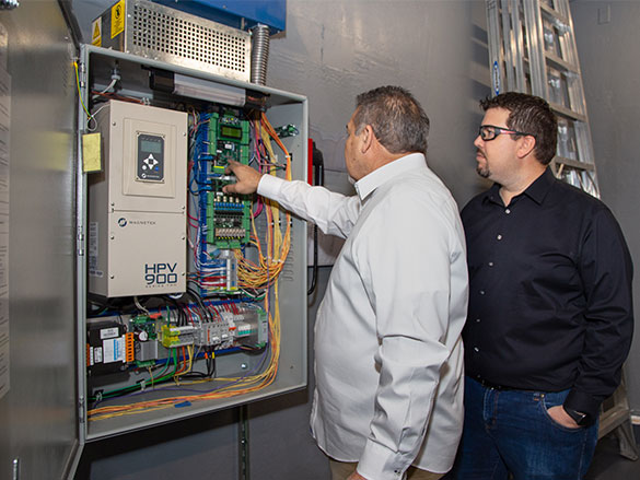 Sandoval Elevator's specialists performing an inspection on equipment